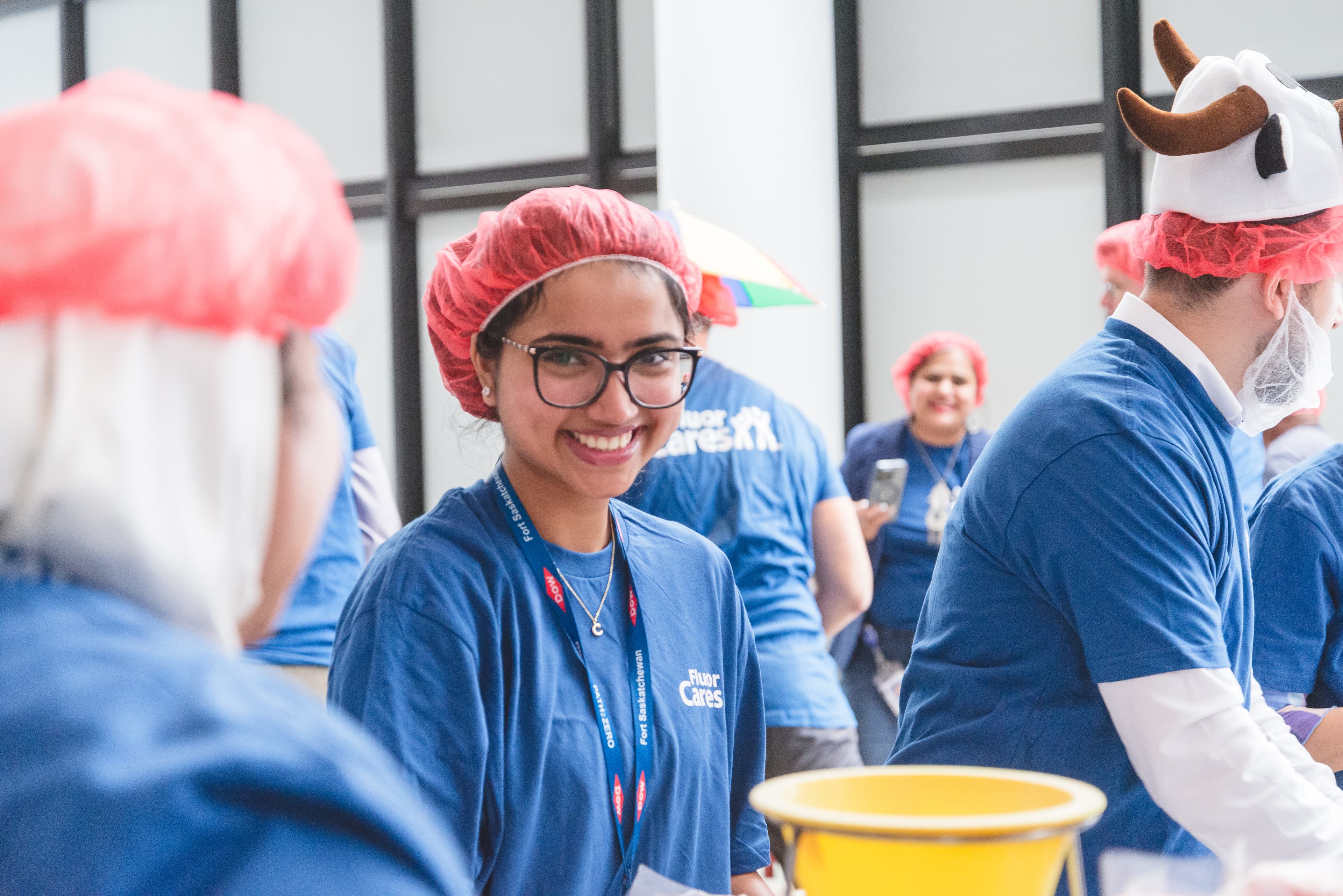 Fluor volunteers with hairnets